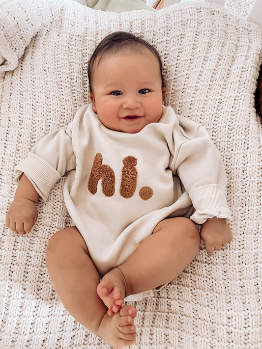 "hi." Graphic Romper for Infants